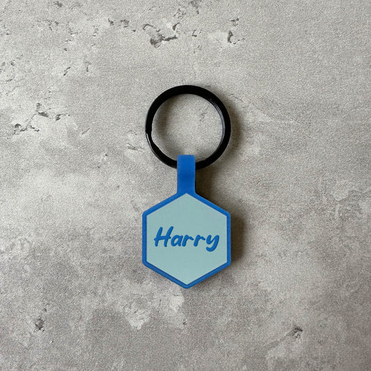 Light blue name tag for dog - Font Anton